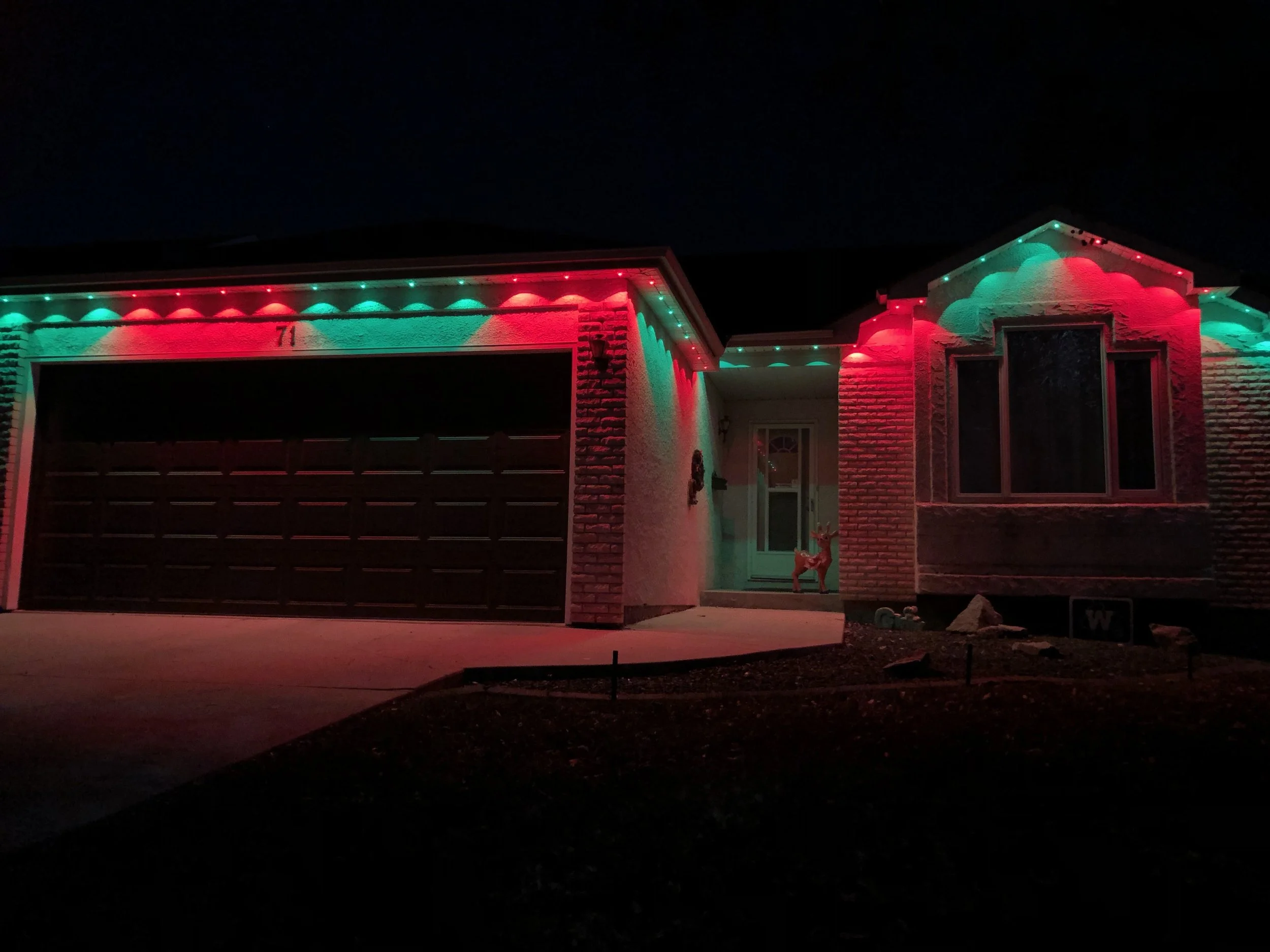Permanent outdoor lights set up to complete the client's holiday decor. 