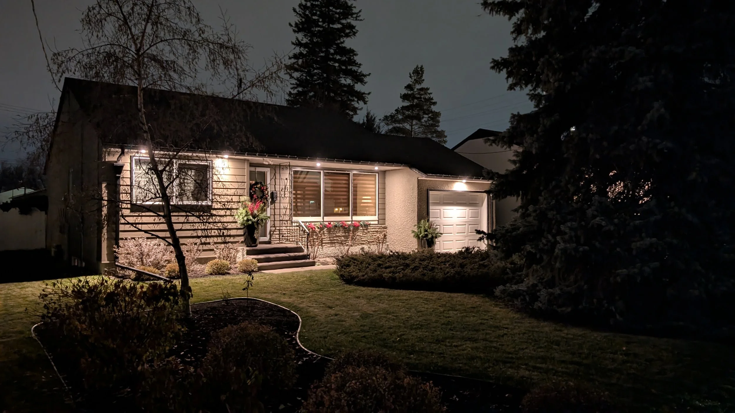 Soffit lighting design that brings forth the curb appeal of a home at night.