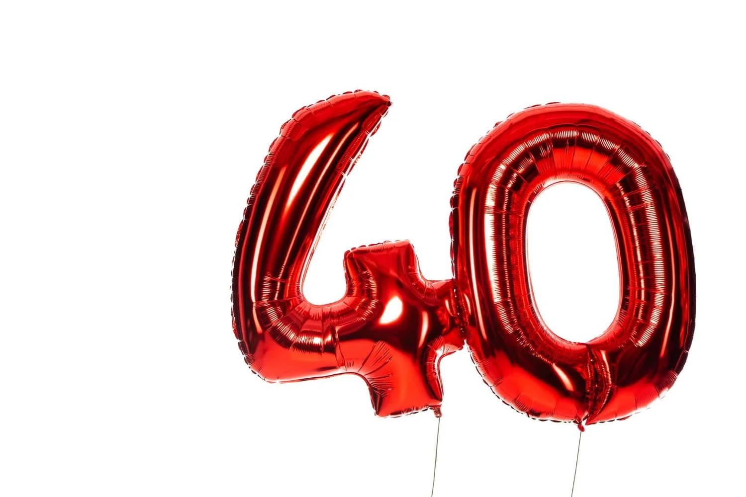 Two red balloons together, numbers four and zero, showing the age of 40.