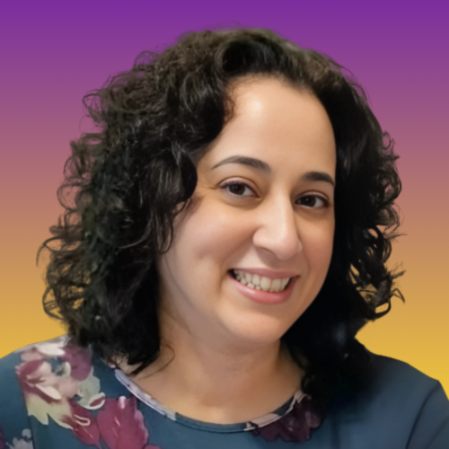 Photo of Veronica Allende, founder and CEO of healthwealth. She's smiling, and her dark hair is curled around her face.