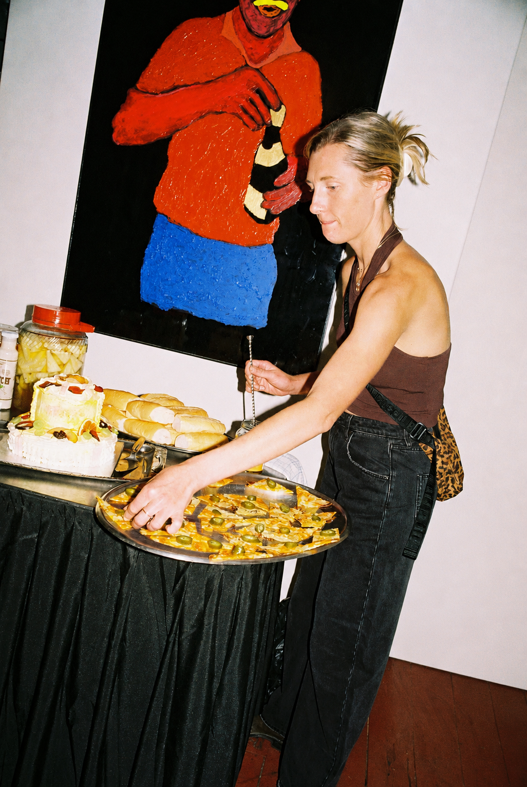 Caterer plating Mediterranean canapés at a private event in Melbourne.