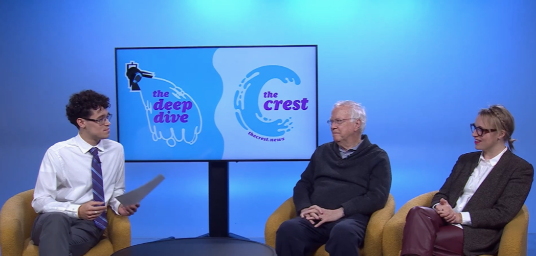 Jill Carey sits alongside Bill Doherty and host Kevin Lynch in front of a blue background and The Crest logo.