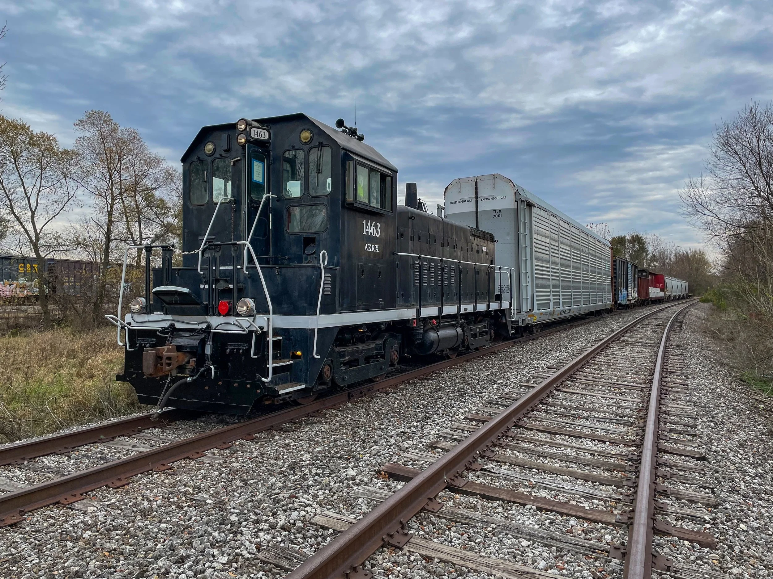 AKRX 1463, EMD SW14, pulling freight.