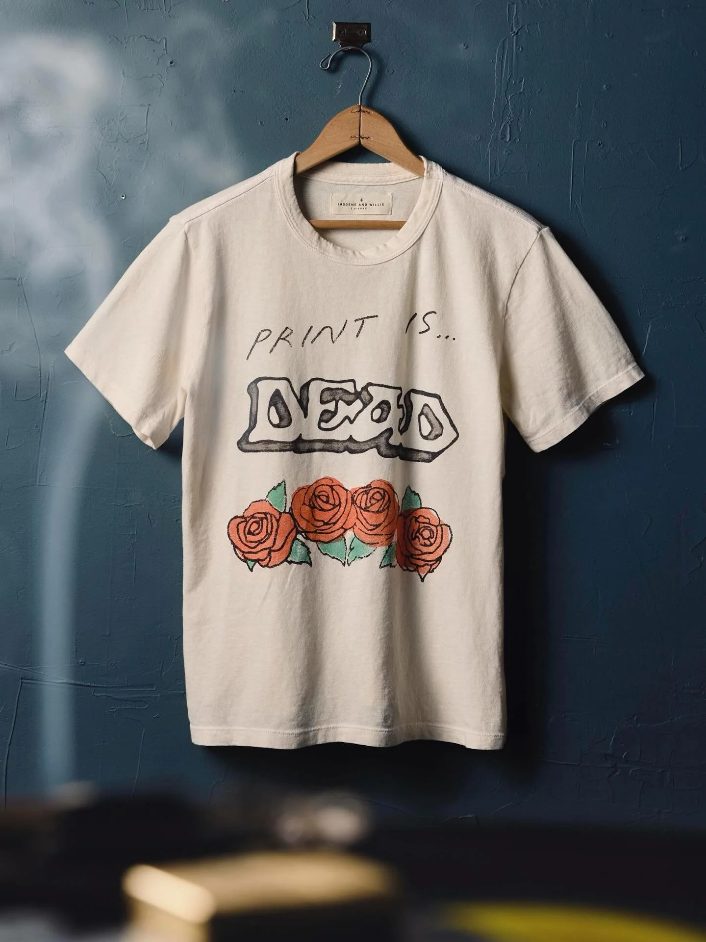Worlds collide. I’ve been a reader of Relix and a fan of the Grateful Dead for many years. I also happen to love graphic tees and I work in the print industry. Hmm… π€
“‘Print is Dead’ T-Shirt Puts Roses on 50 Years of