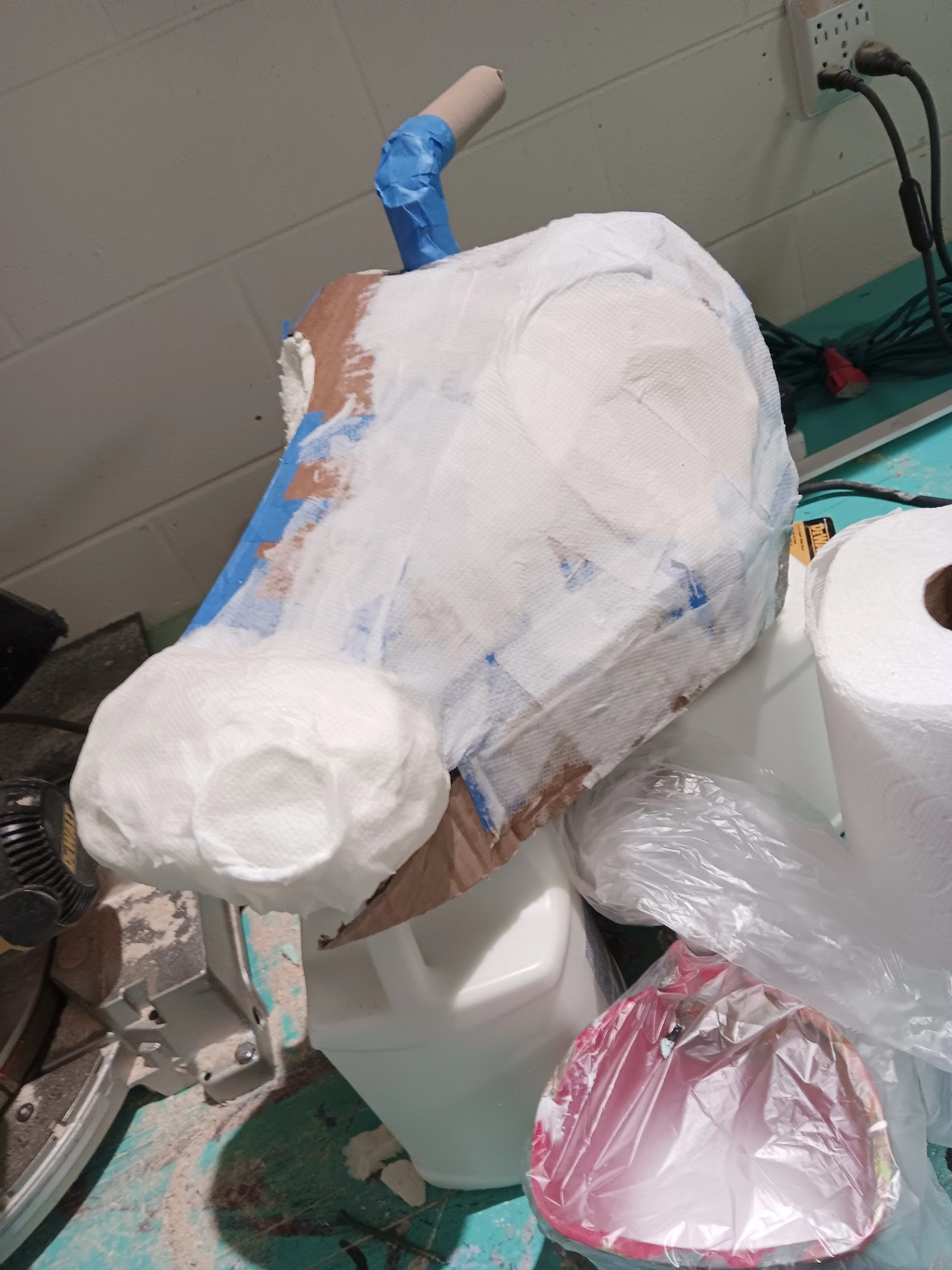 Covering and defining with paper mache.