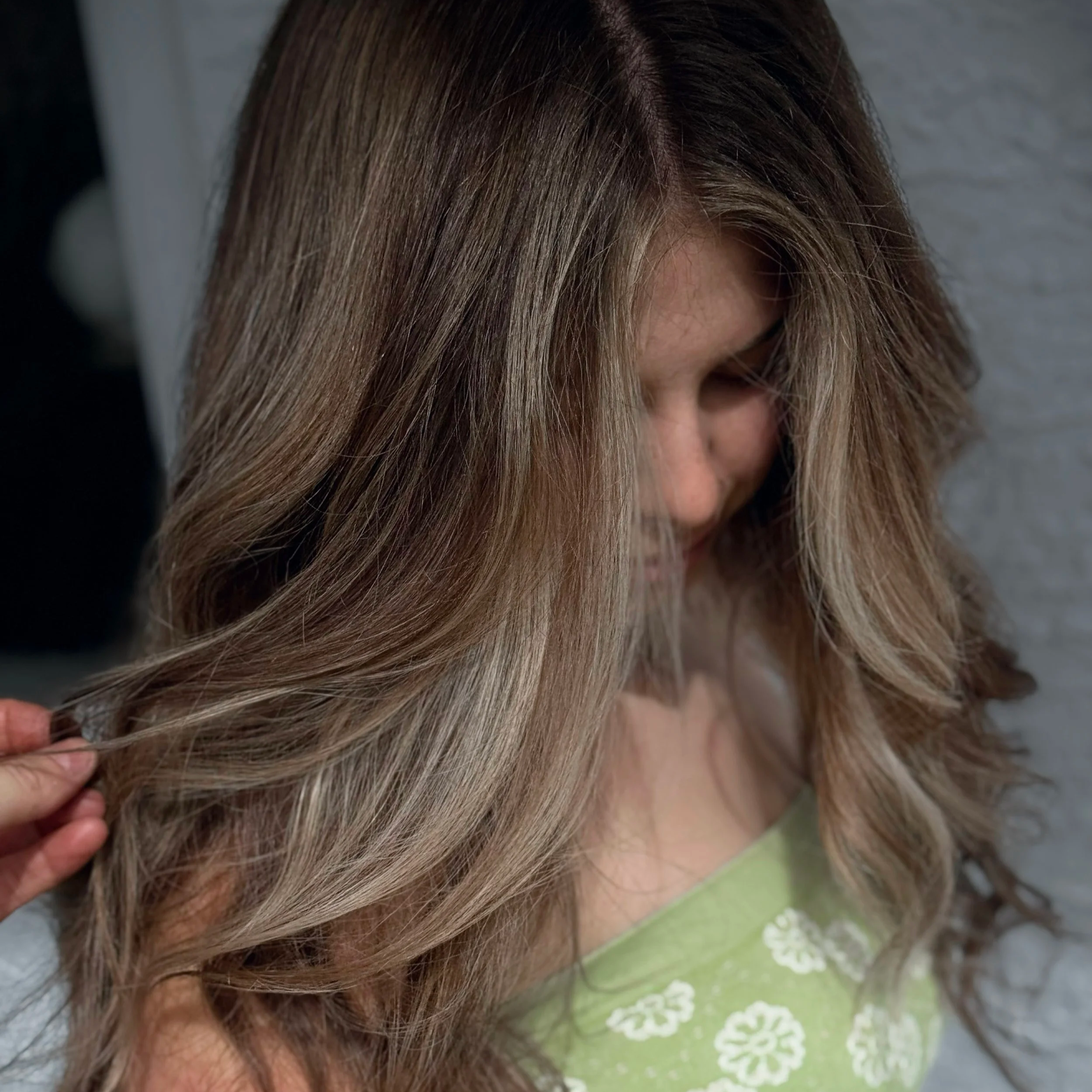 medium brown hair with cool toned ribbons of dimension