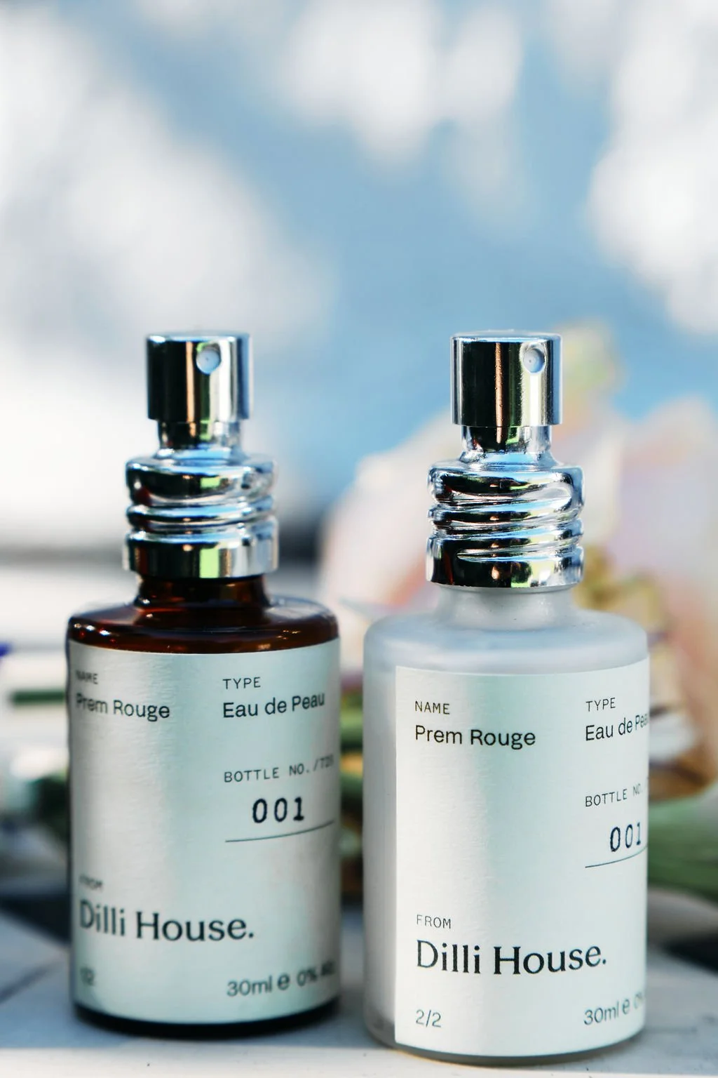 The two Prem Rouge bottles, rose and tuberose, alcohol-free, in daylight