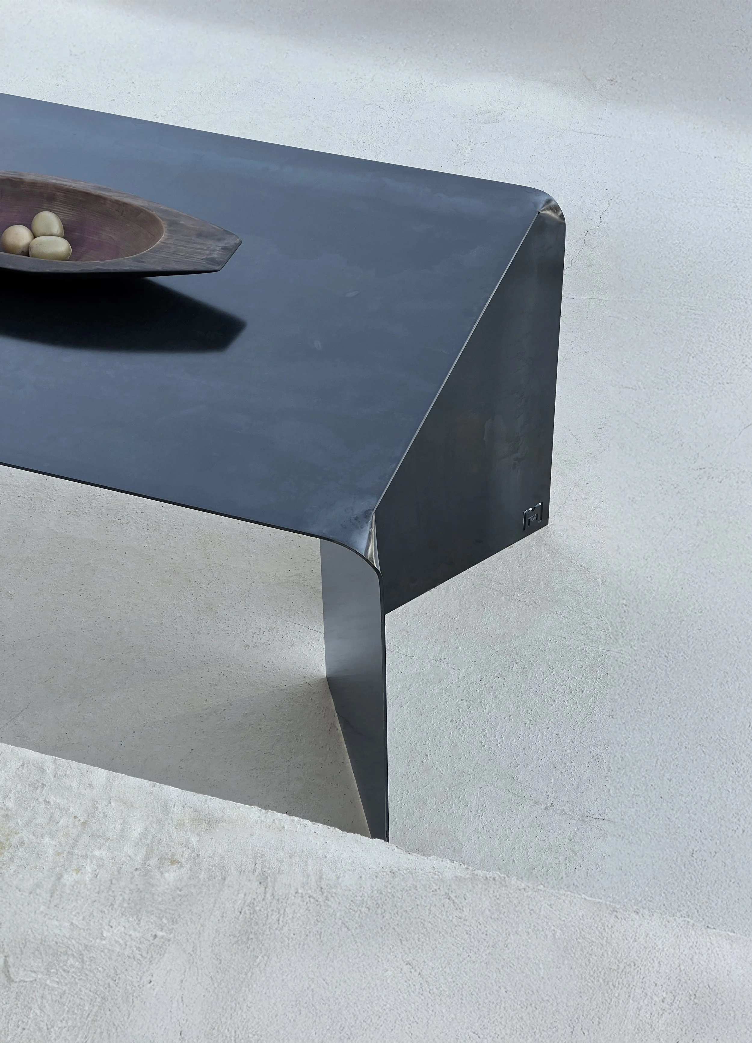 DOA black steel side perspective vase concrete platform.jpg