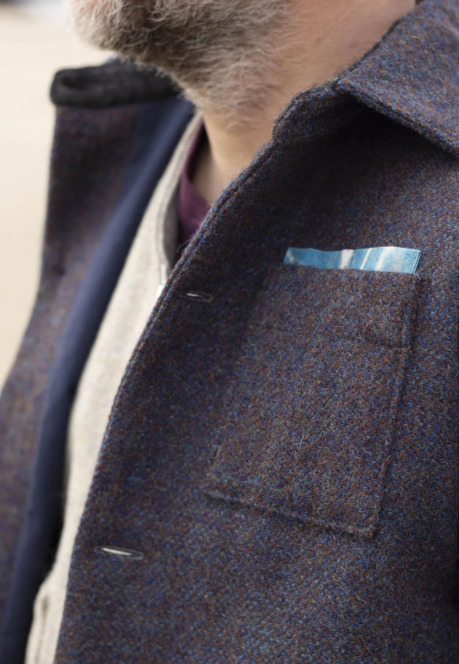 Detail of dark purple Harris Tweed Jacket with bright blue Cyanotype pencil tab on chest pocket