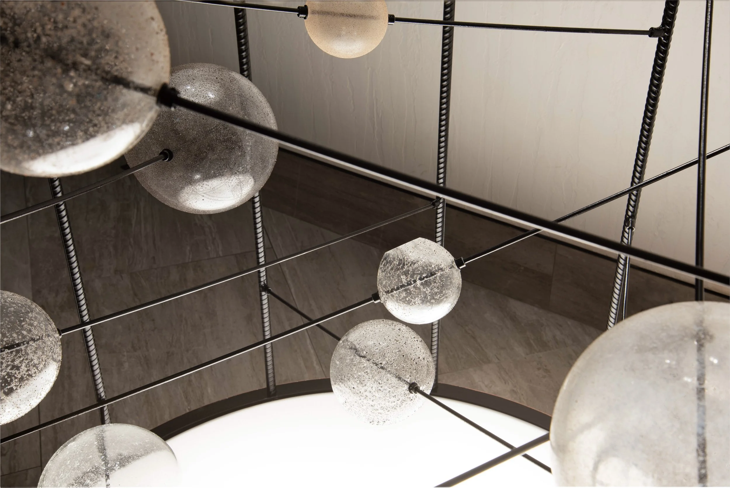 Details of the glass spheres infused with sands from globally diverse locations