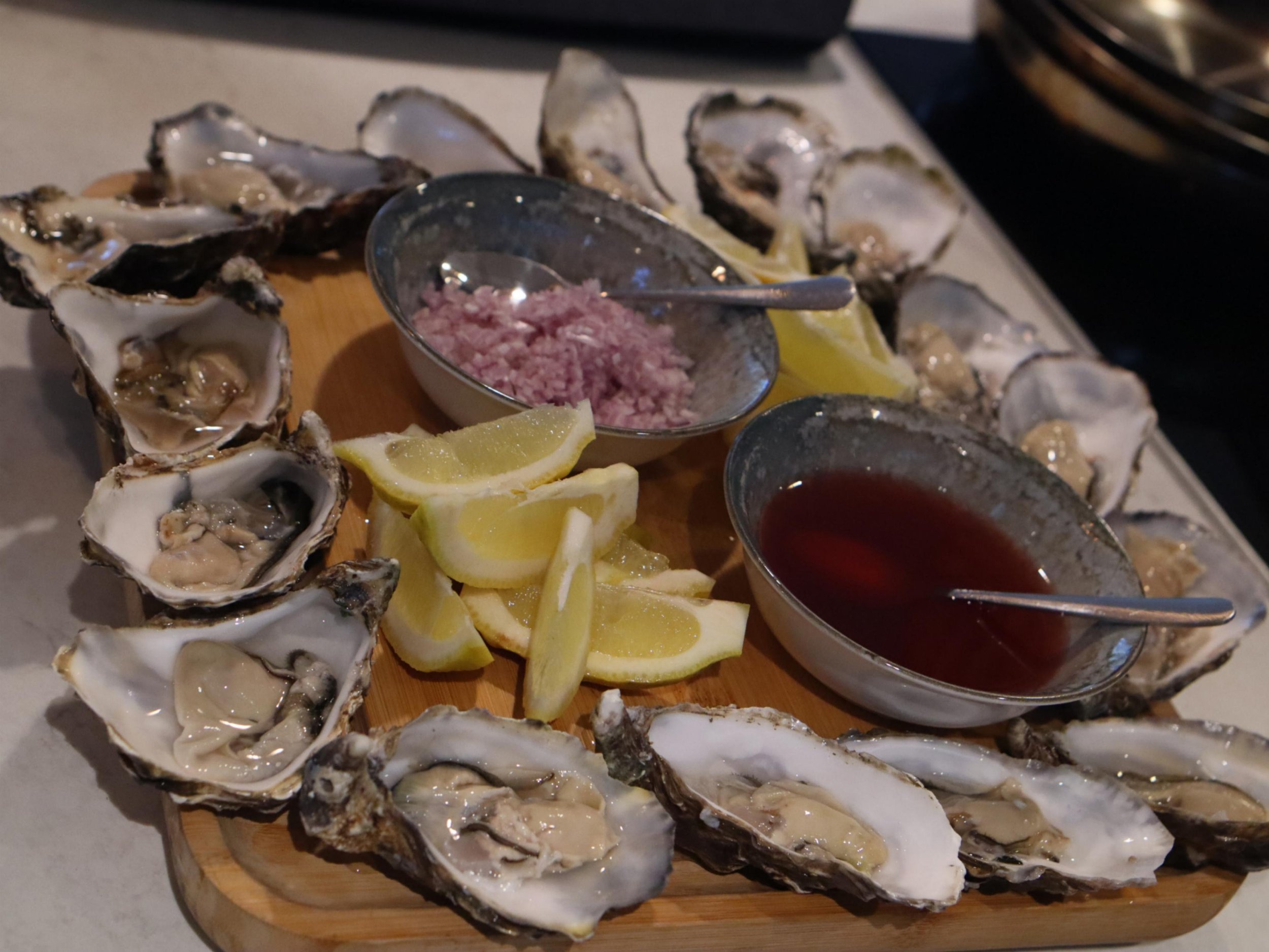 Fresh oysters served with lemon wedges, chopped shallot and red wine vinegar dressing.
