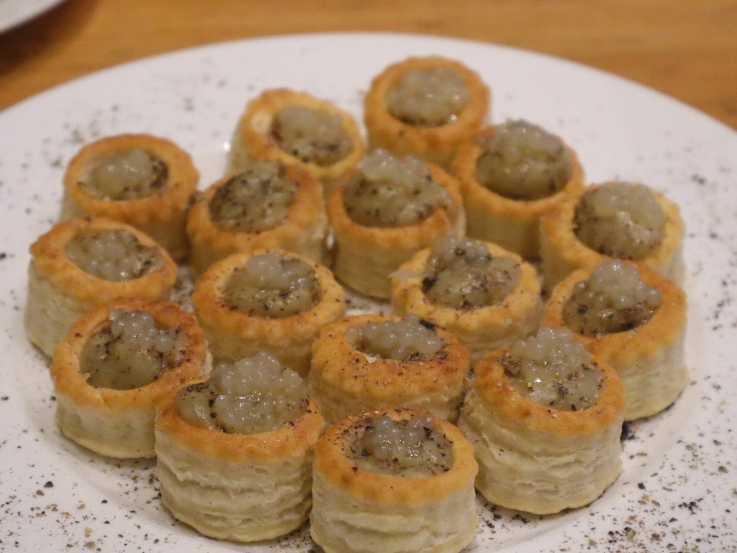 Mini puff pastry vol-au-vents filled with a creamy mushroom mixture for canapé service.