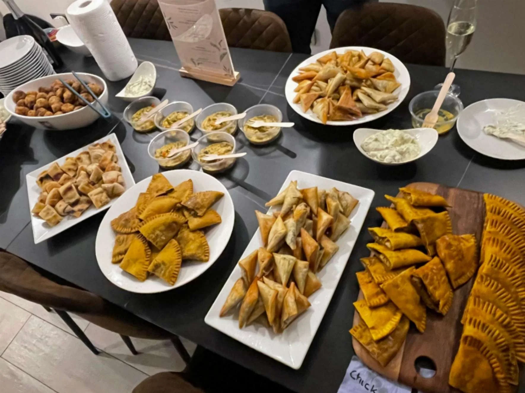 Greek Tings buffet spread with Jamaican patties, filo pastries, dips and bite-size fusion dishes.
