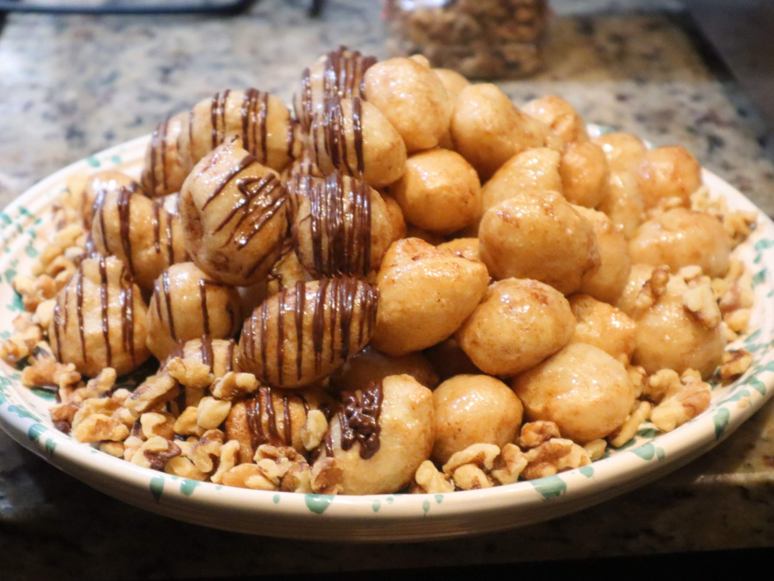 Greek loukoumades doughnut balls drizzled with honey and cinnamon.
