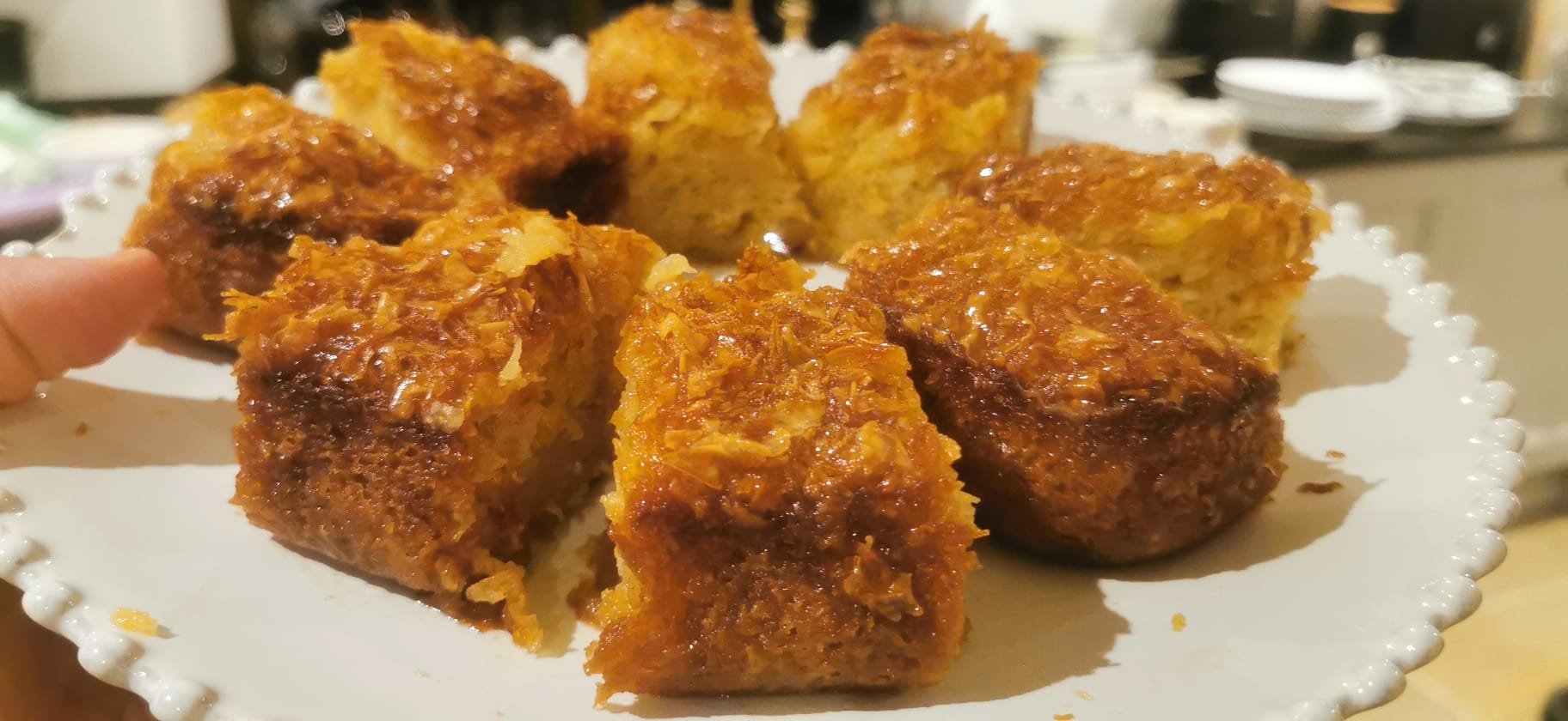 Warm syrup-soaked Greek galaktoboureko with crisp filo and custard.