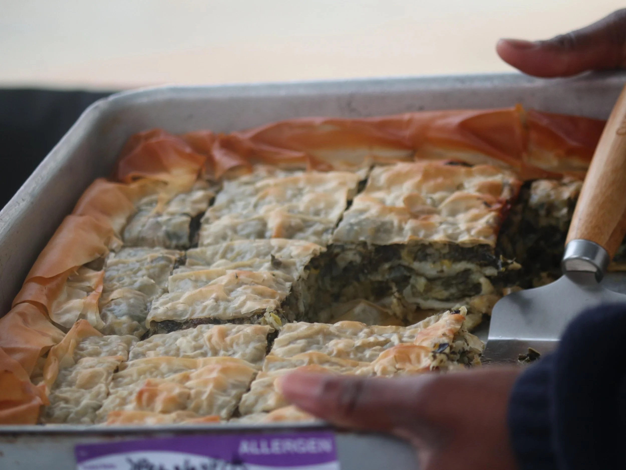 Golden Greek spanakopita filled with spinach, leeks, feta, dill and fresh herbs