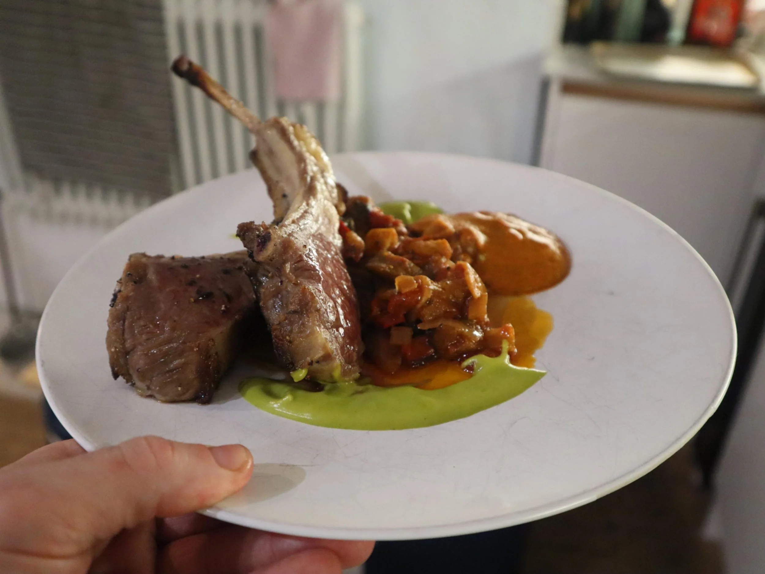 Plated lamb with seasonal vegetables and smooth purée for a British private dining menu.

