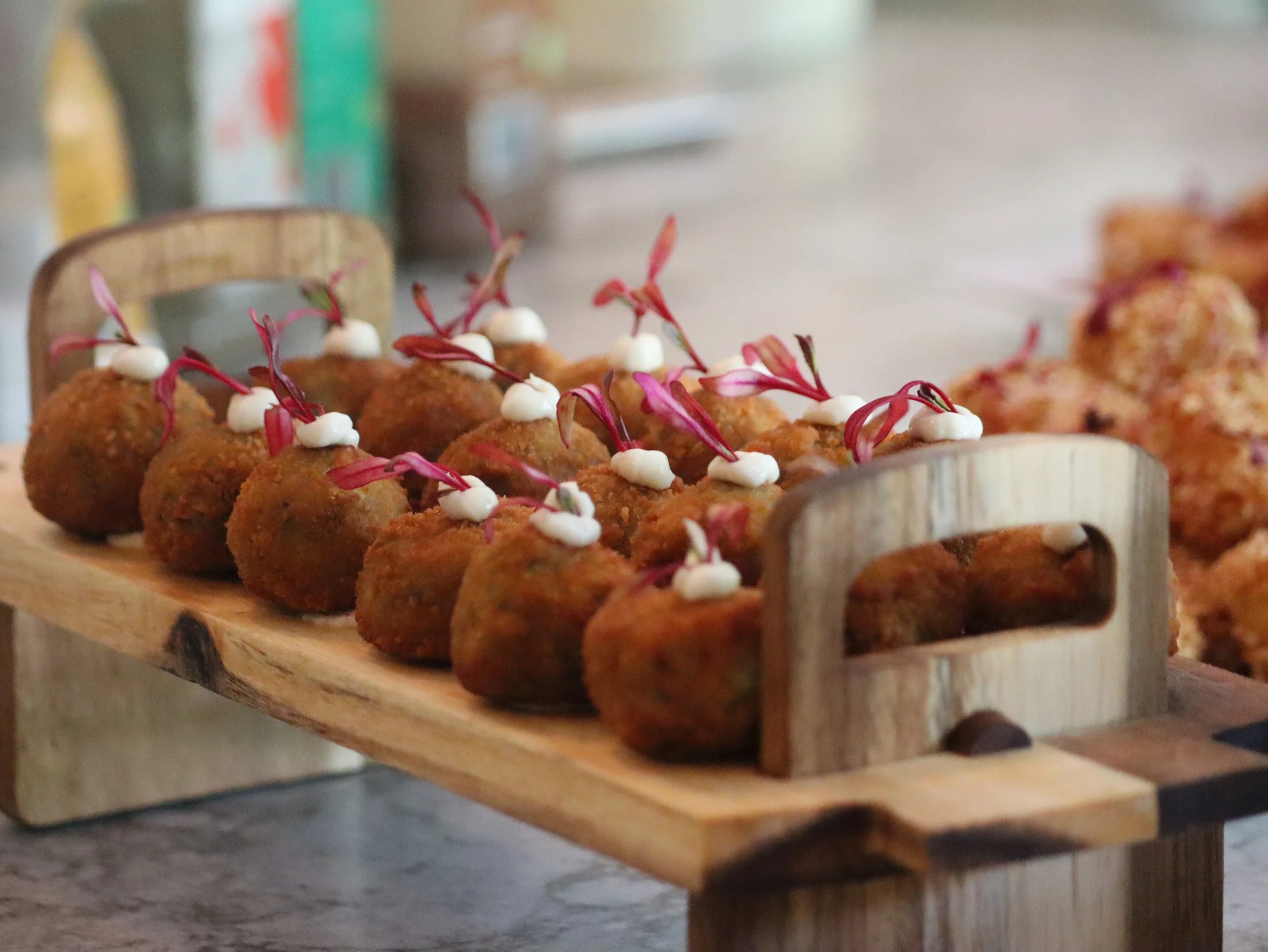 Crispy fusion potato croquettes, packed with aromatic herbs and spices, coated in golden breadcrumbs, and finished with fresh micro-herbs and creamy vegan mayo Gluten-free option available.
