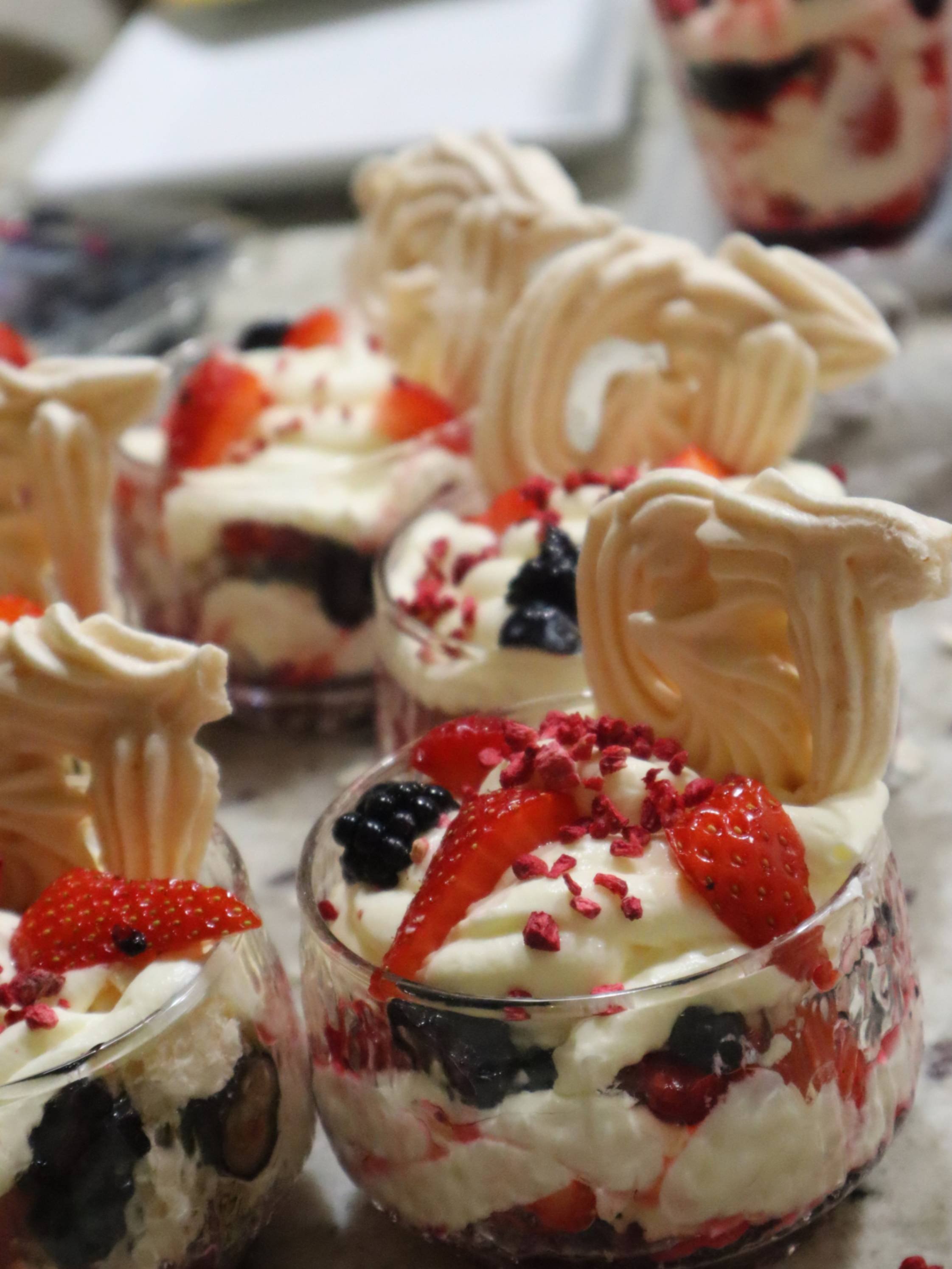 Eton mess prepared in glasses for private dining service.