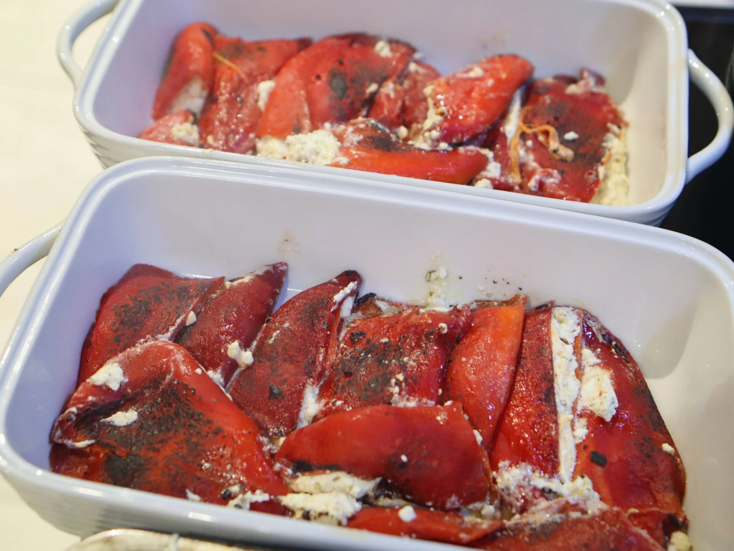 Roasted red peppers filled with creamy cheese and herbs for a Greek Tings fusion menu.