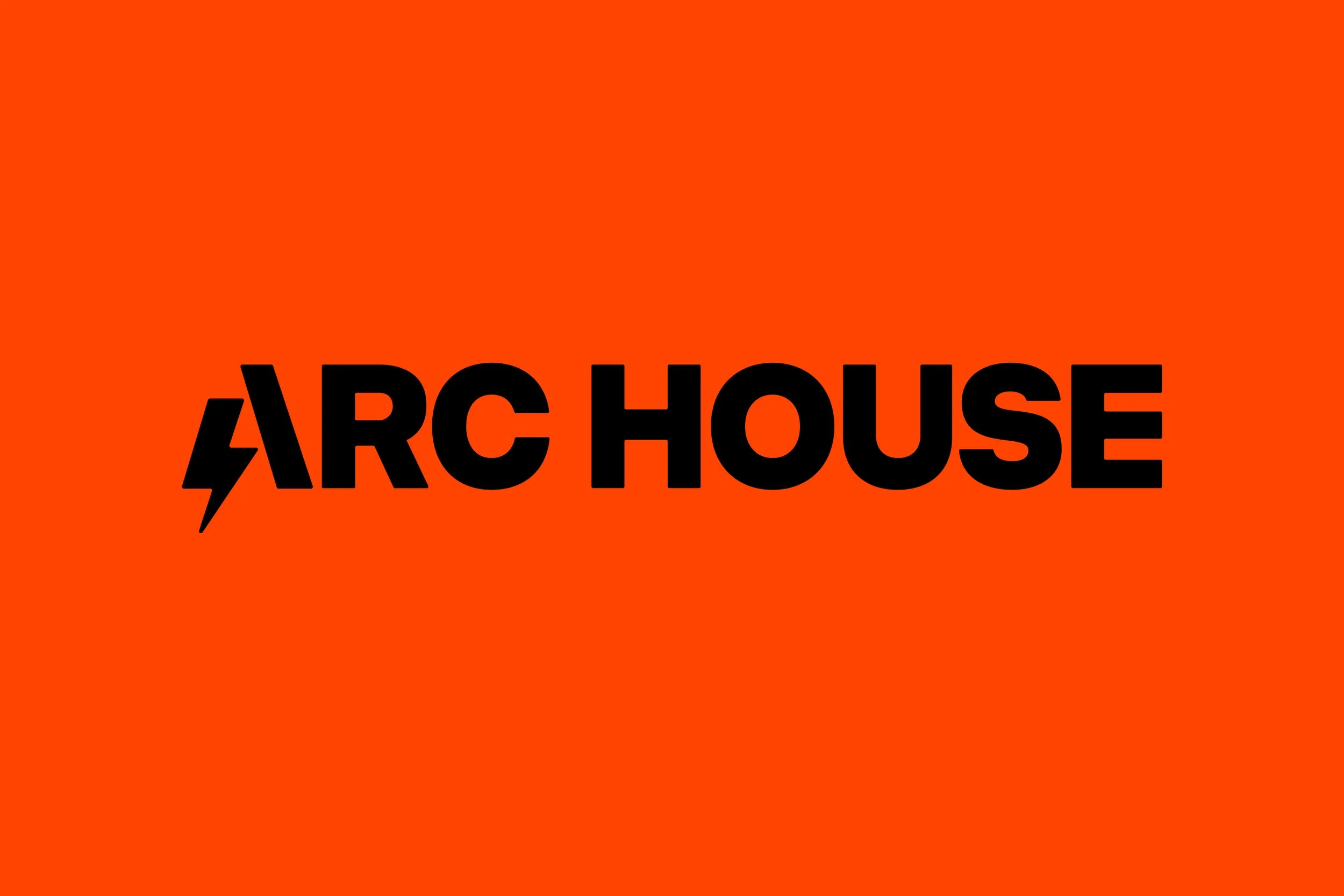 Orange background with black text saying "ARC HOUSE" and a lightning bolt symbol.