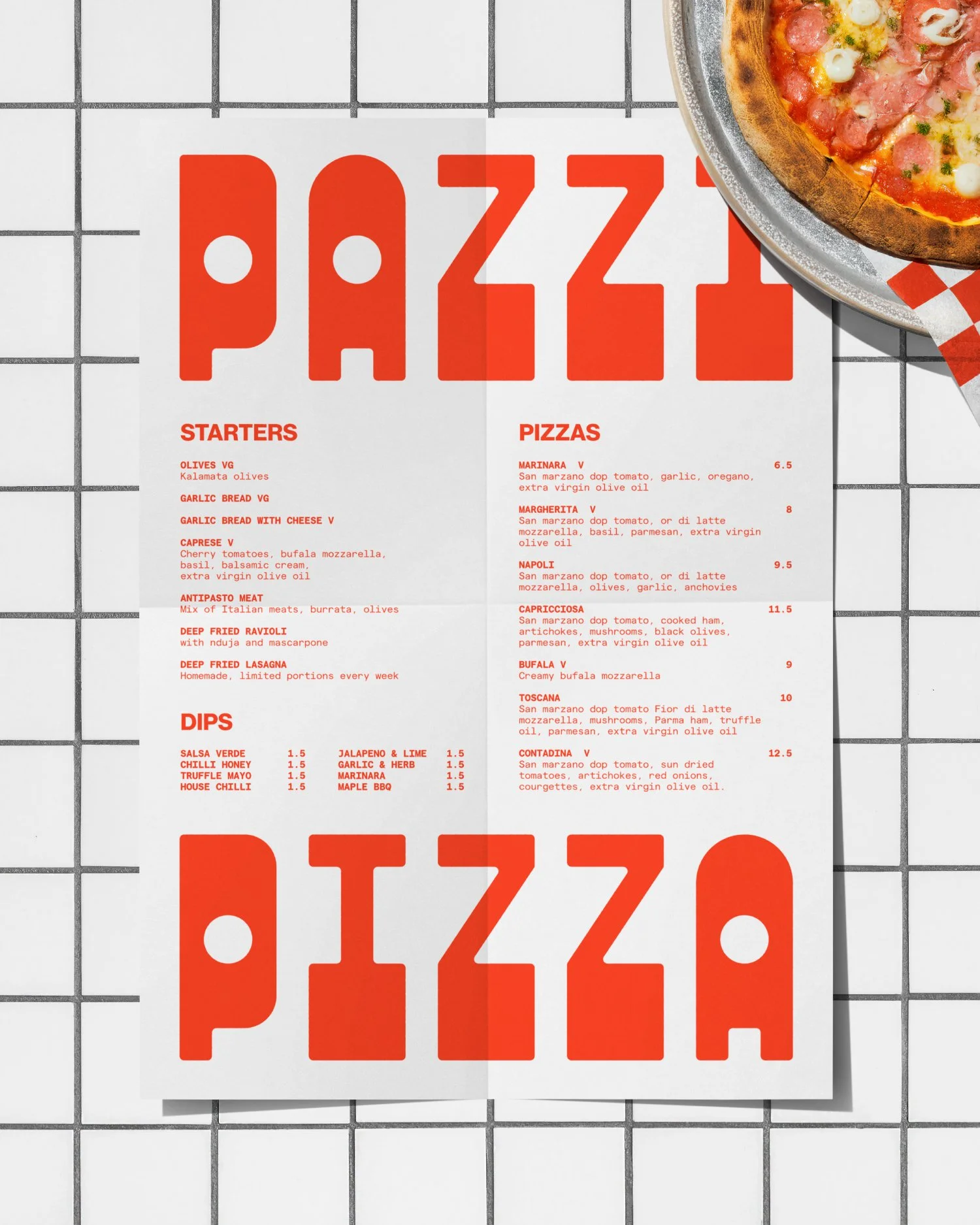 A pizza restaurant menu with sections for starters, dips, and pizzas, featuring various pizza options like Margherita, Napoli, Capricciosa, and others. The menu is printed on white paper with red text and is placed on a white grid countertop, with a pizza partially visible in the top right corner.