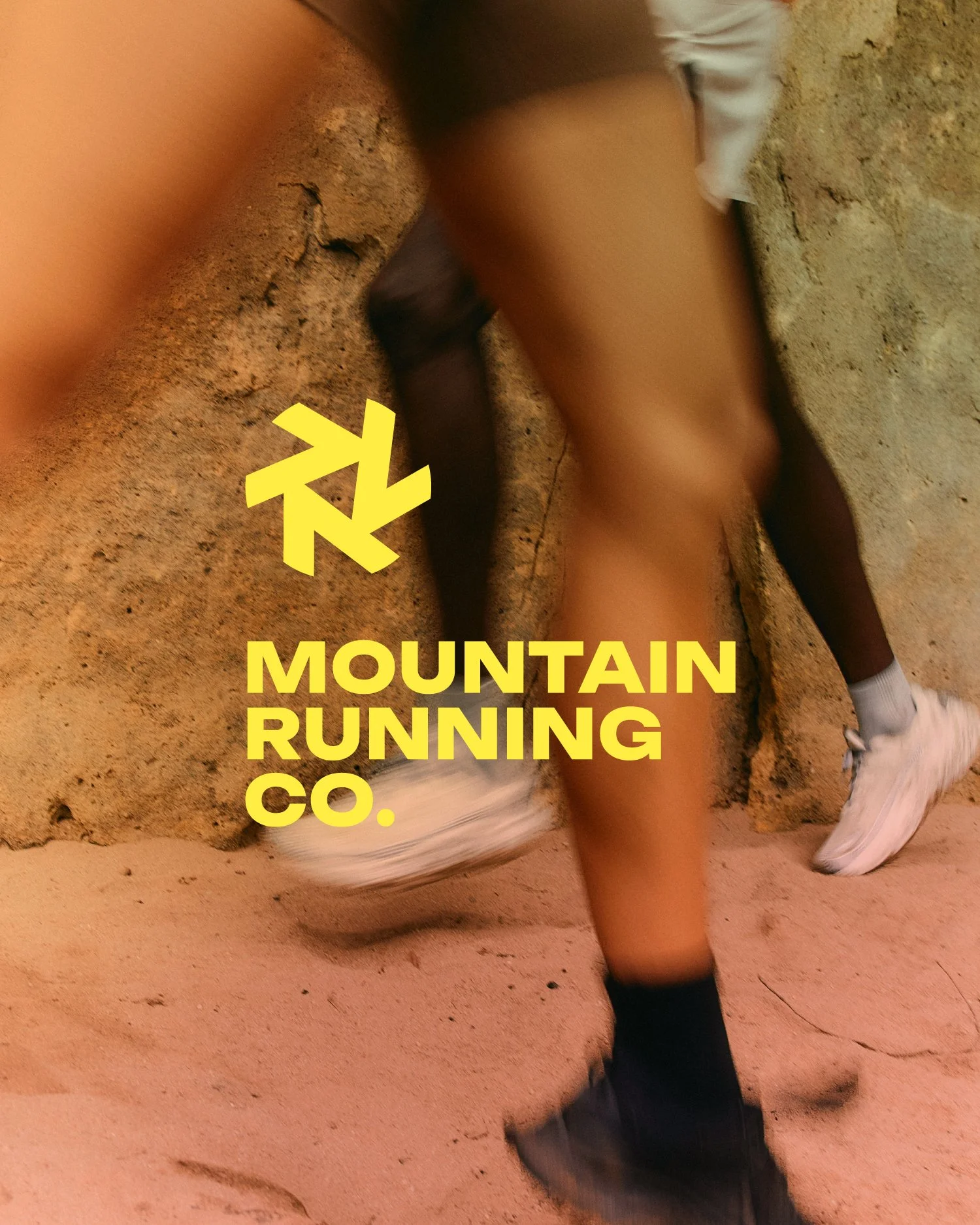 Person running on a rocky trail with the text 'Mountain Running Co.'
