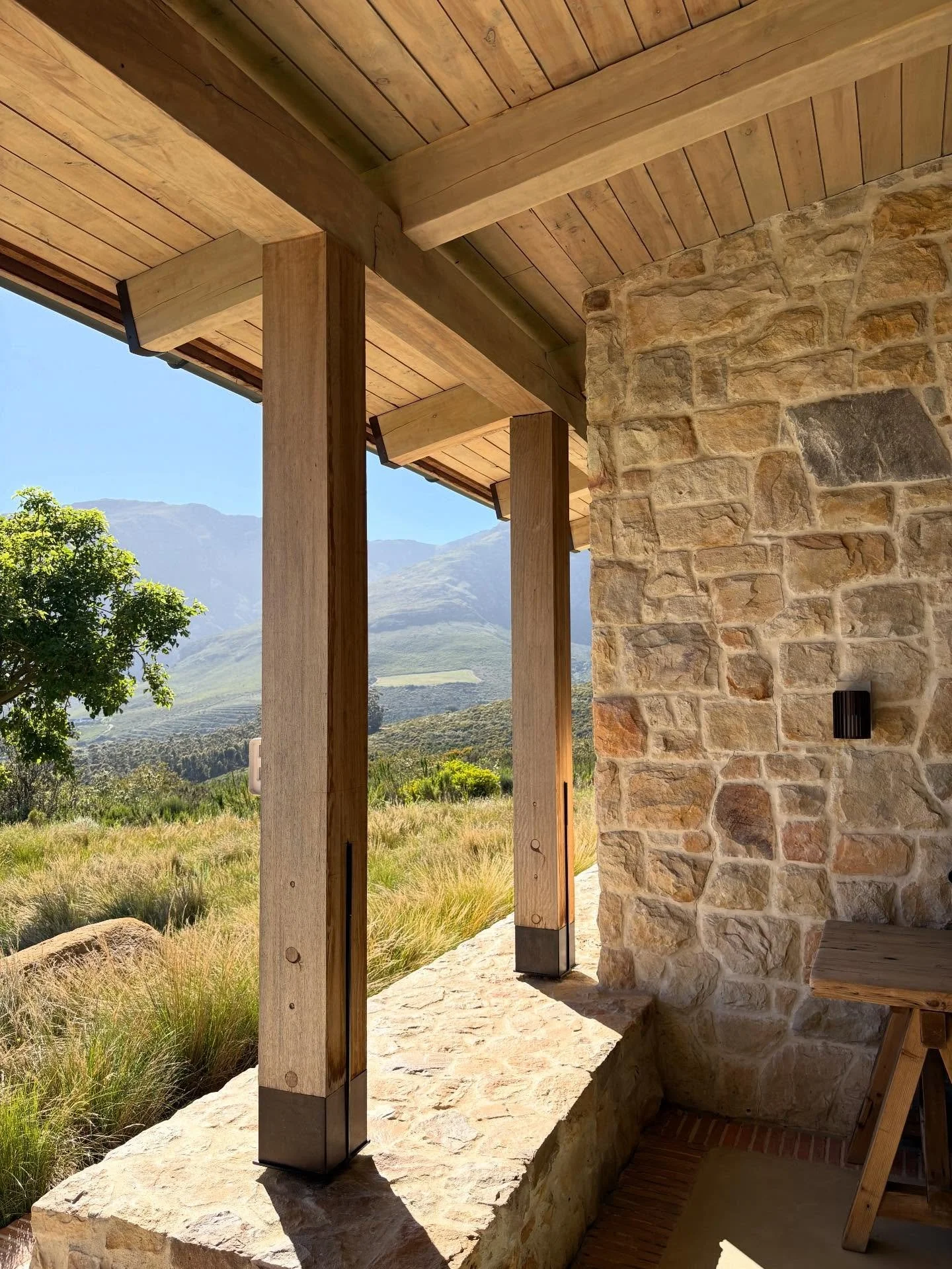 Light filtering through, natural textures and a horizon that settles the space for a slow moment outdoors