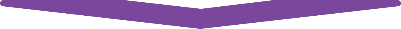 A shot of a stage with a purple banner and chairs.