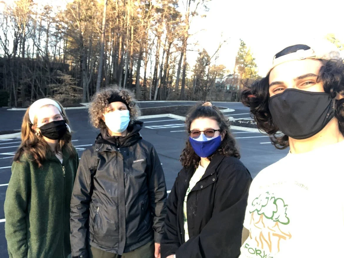 A group photograph of the We Plant it Forward team