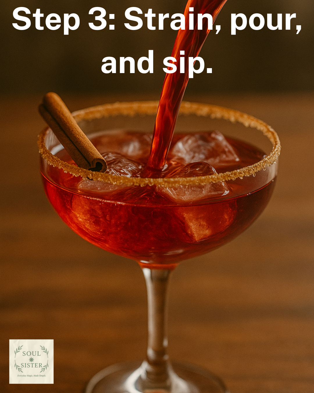 Cinematic red cocktail being poured into a coupe glass with a cinnamon stick.