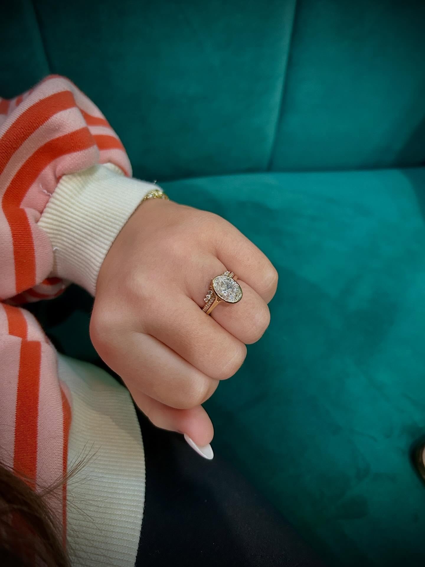 Isn&rsquo;t she a stunner? ✨
&bull;
&bull; 
&bull; This beautiful 14K Yellow Gold, 3 Carat Oval Lab Grown Diamond, Bezel Set Engagement Ring goes perfectly with this 14K Yellow Gold, Tiara Shaped, Diamond Wedding Band🤩👑 
. 
. They are BOTH currentl