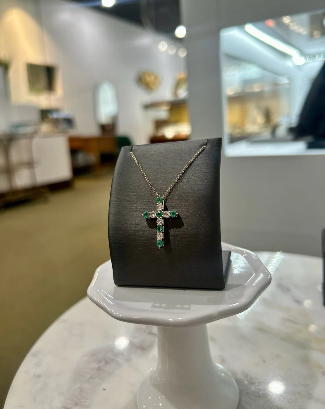 A cross with a touch of emerald💚✝️
&bull; 14k Yellow Gold
&bull; Alternating Emerald &amp; Diamond Cross Pendant
&bull; Available at Jamies!!! 
#jamiestdm #virdenillinois #crossnecklace #emeralds