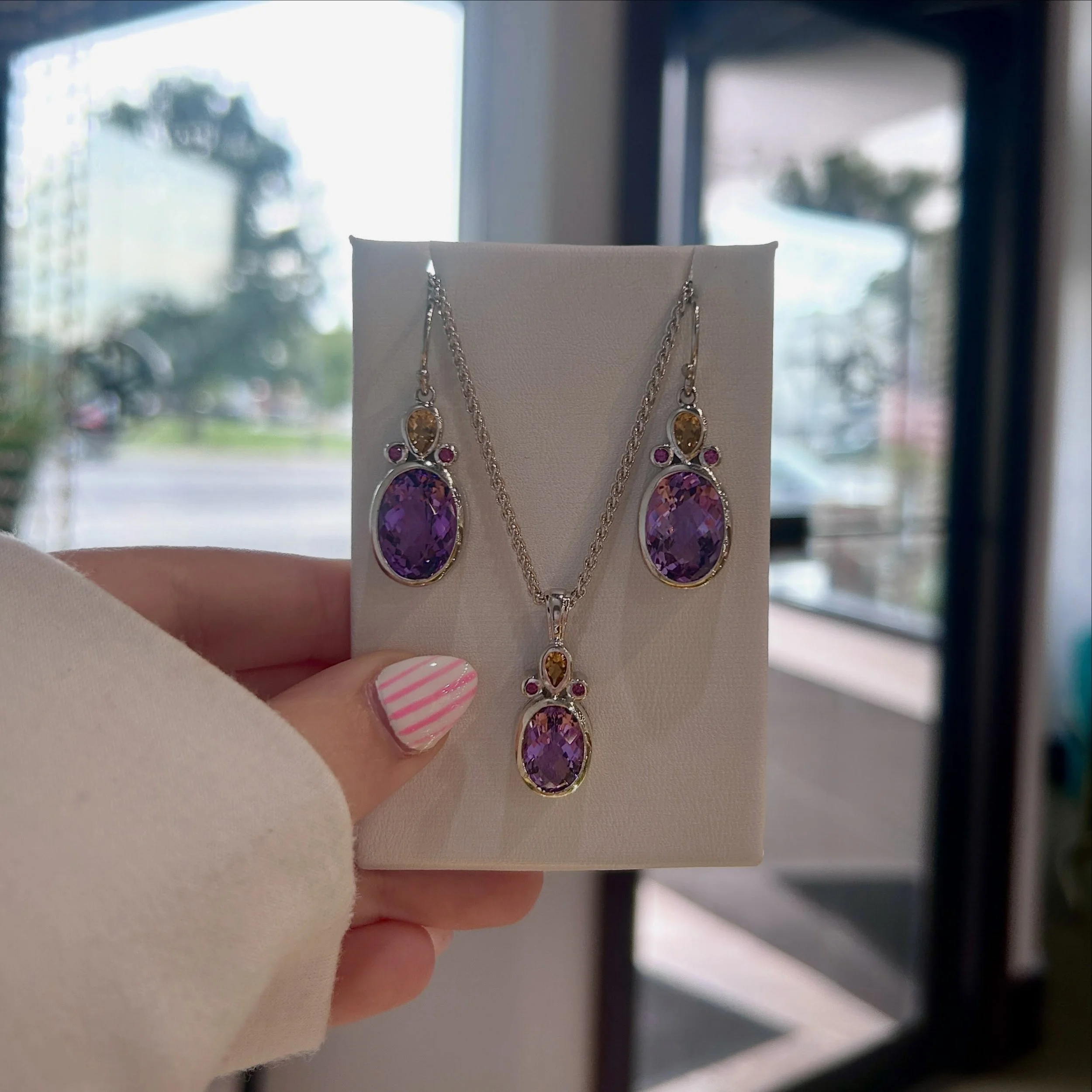 Silver lovers, we have another good one for you! 
🩷💜🧡
These Sterling Silver earrings, as well as the matching necklace, contains Amethyst, Citrine, and Rhodolite Garnets!! 

Open our usual 9:30-5, they are waiting for you🥰