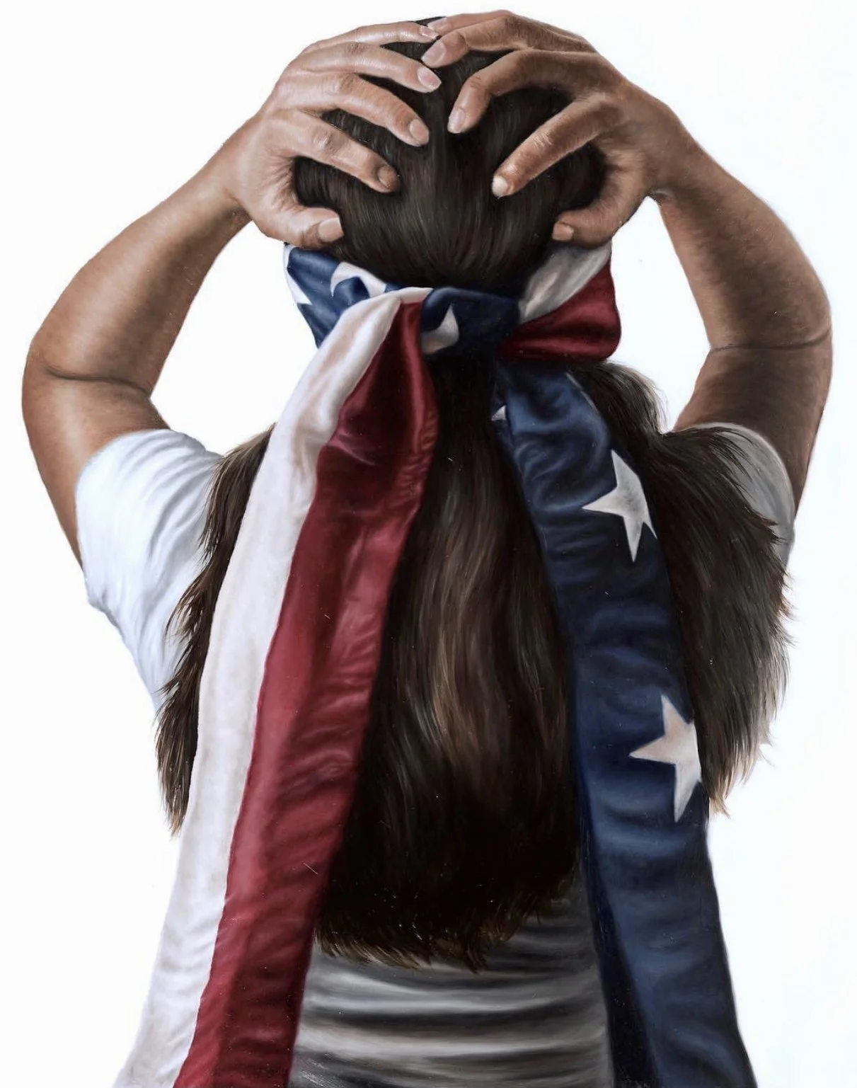 Person with long hair wrapped in an American flag, holding their head with both hands.
