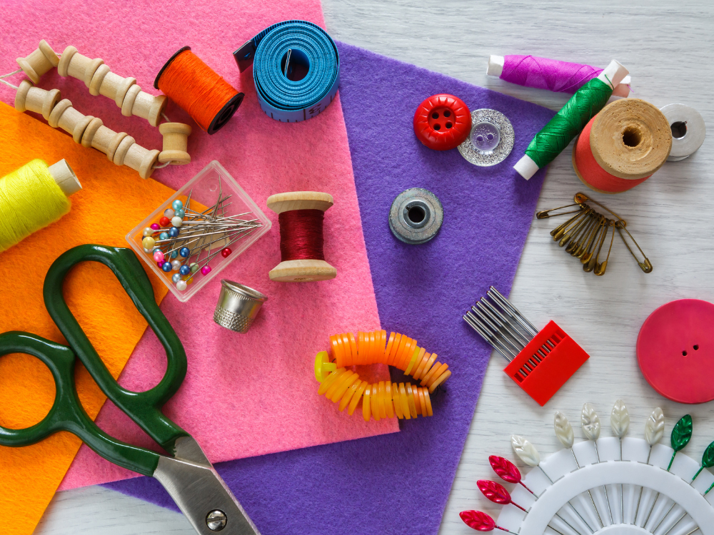 A beginner carefully pinning fabric before sewing, a key step in learning dressmaking techniques.