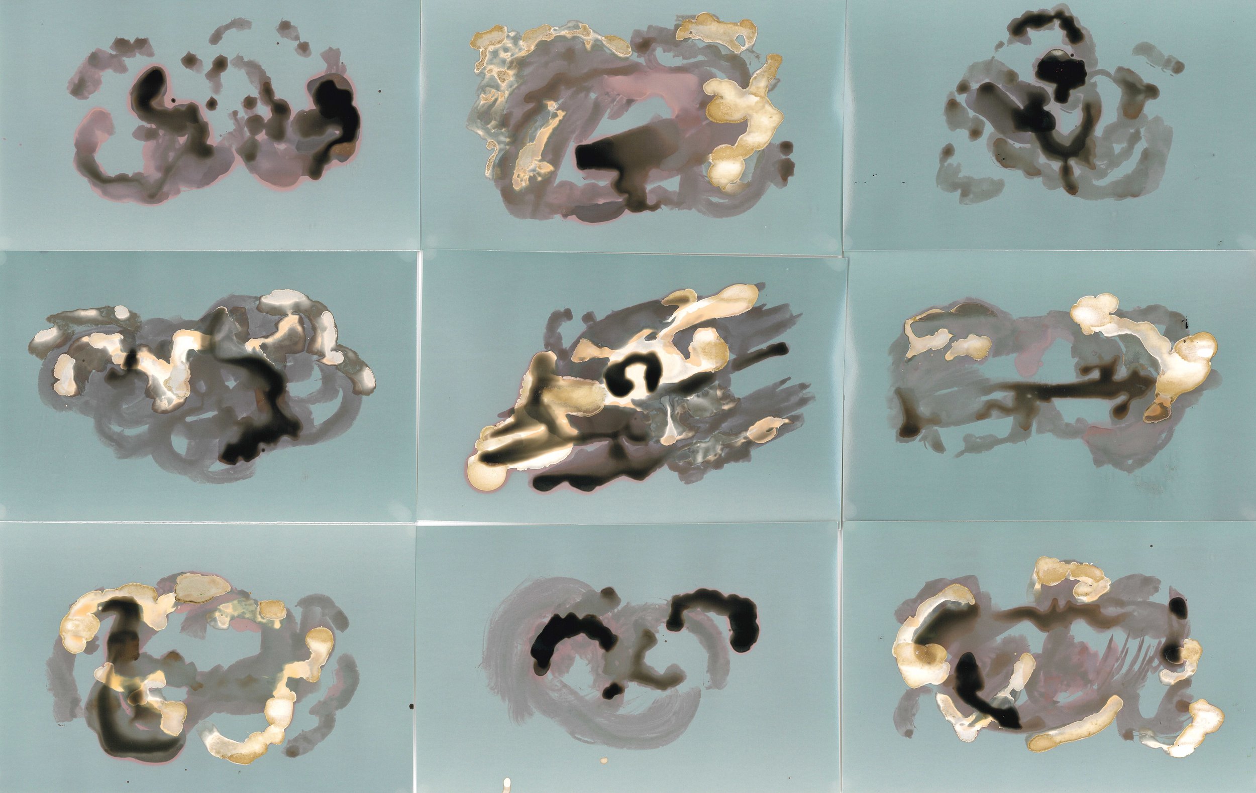 Nine abstract, colorful cloud-like shapes arranged in a 3x3 grid on a light blue background.