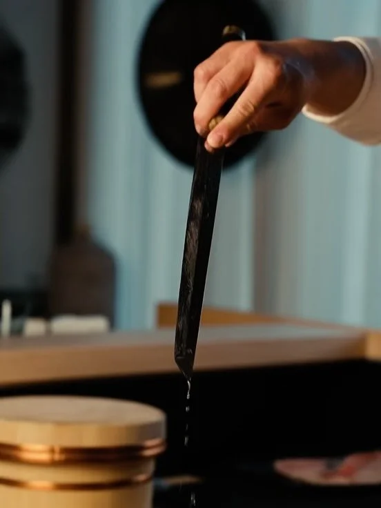 The ritual of the knife.
In sushi, the knife is an extension of the chef. 
Each knife is sharpened in slow, deliberate circles, a figure of eight drawn across stone. A rhythm older than the recipe itself and a ritual performed before each service.