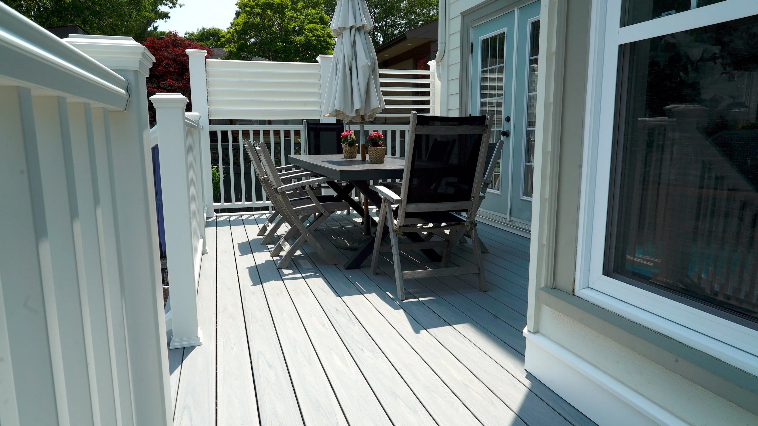 composite decking with aluminum railings and privacy fence with louvers