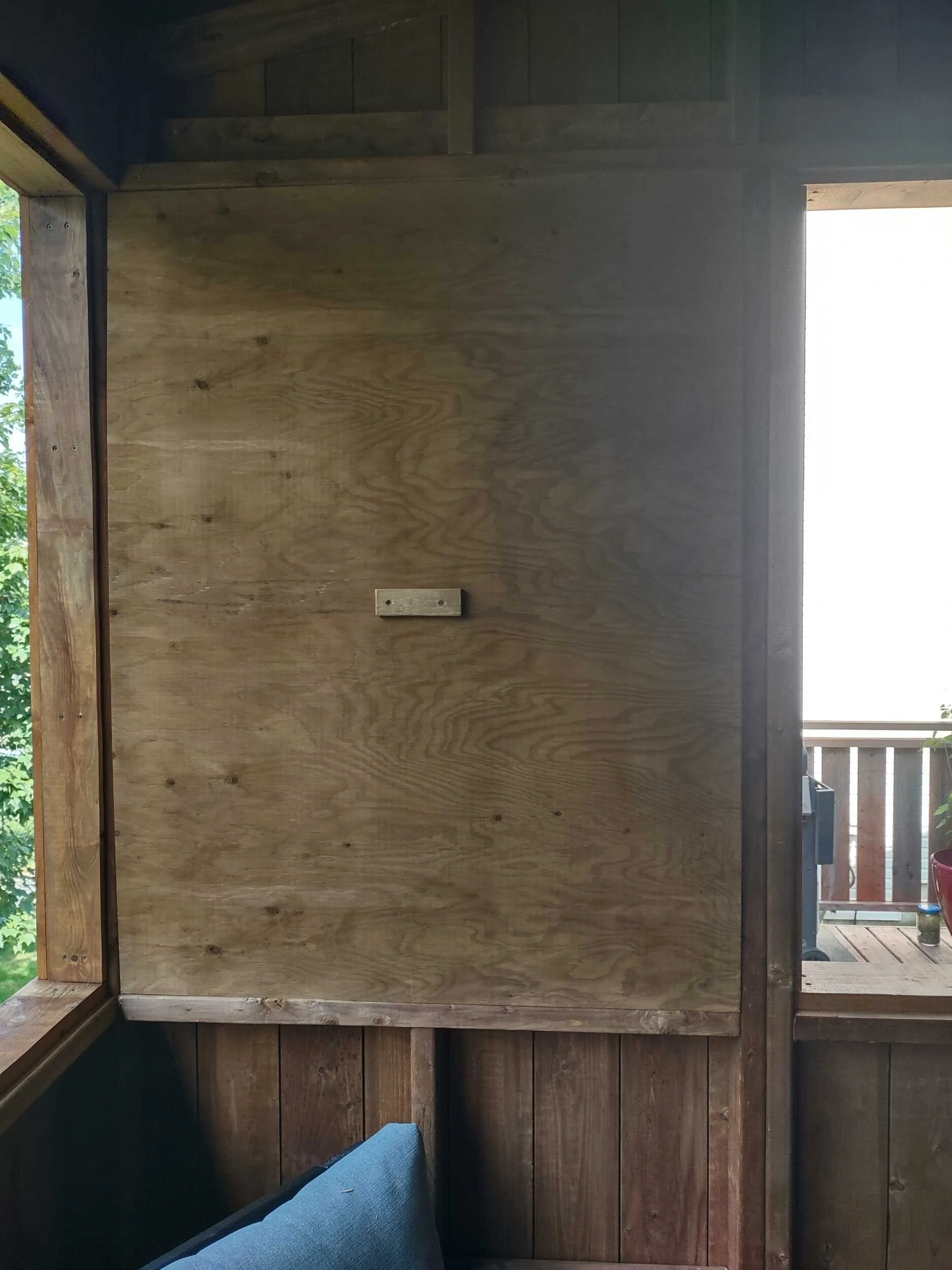 Custom removable winter panel system inside The Treehouse screened deck addition, allowing the outdoor living space to be used year-round in Halifax, Nova Scotia.