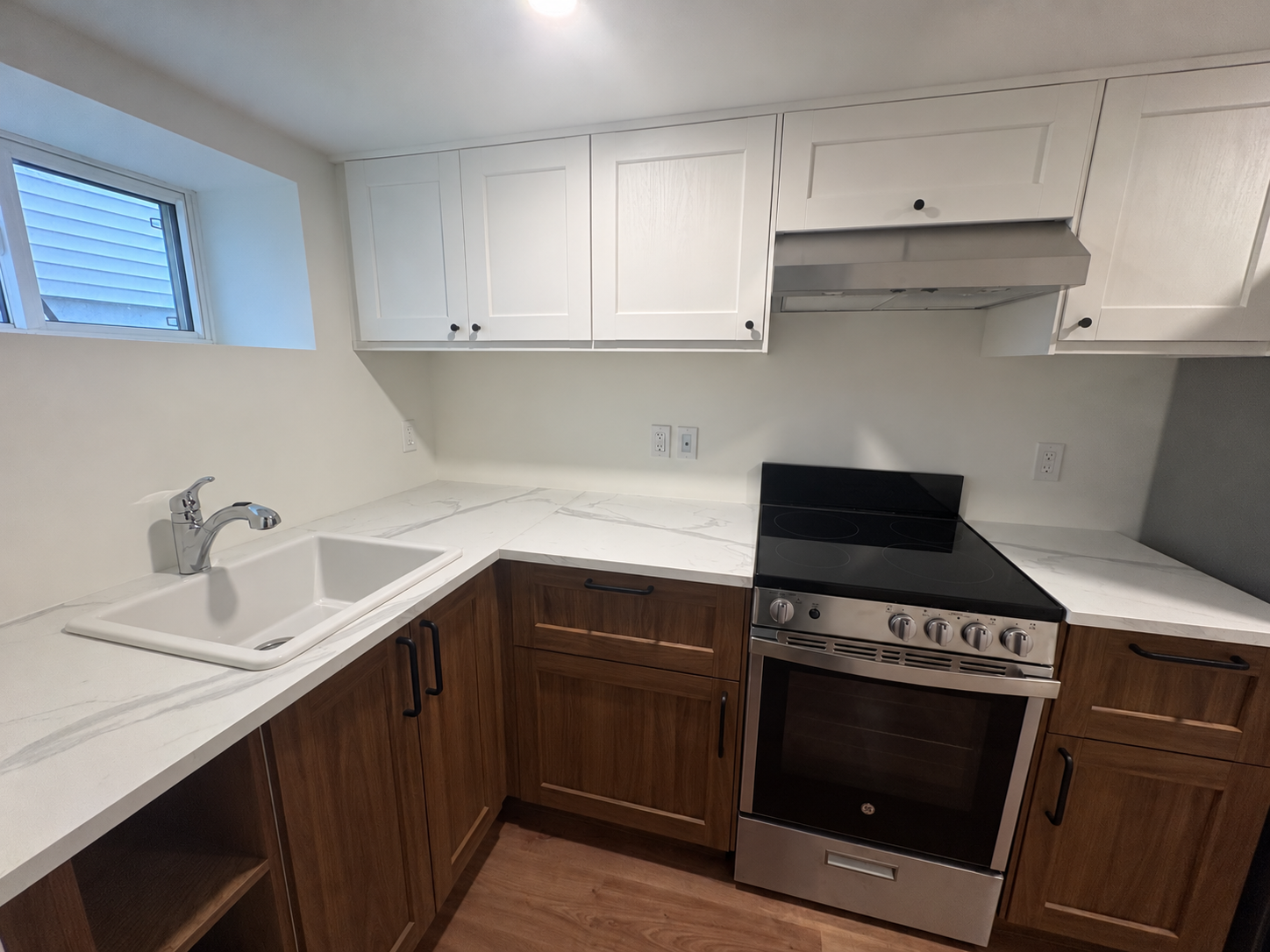 Modern L-Shaped Kitchenette with Stainless Range.png