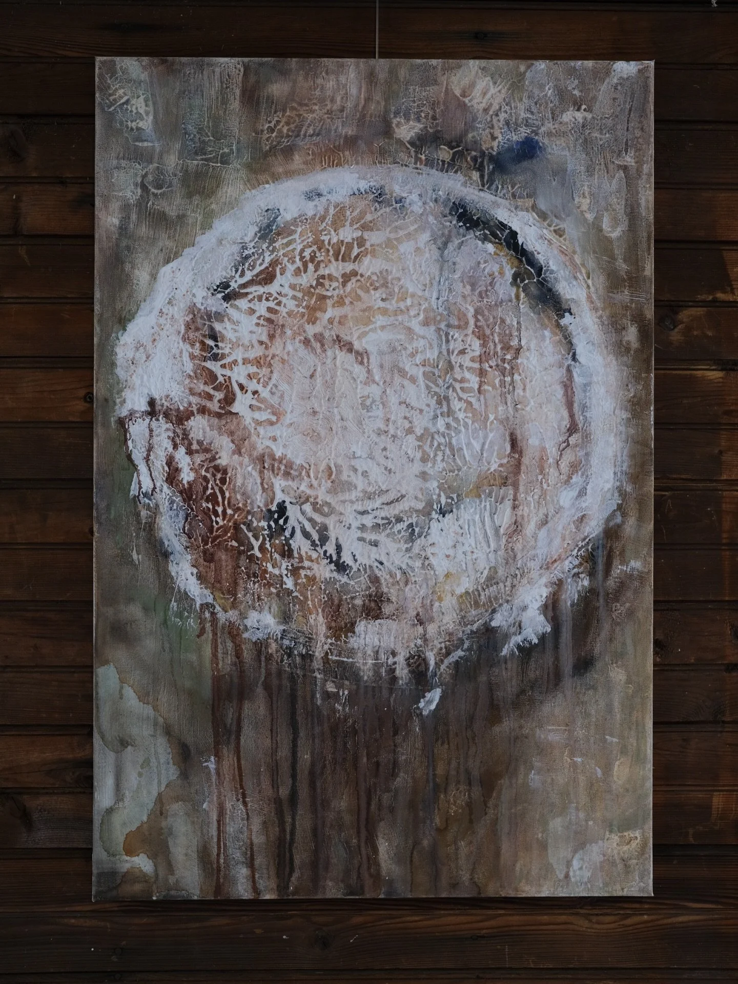 Circular marks reference celestial cycles, tidal rhythms, and the passage of time, evoking an eclipse - an event in which light is temporarily obscured, not erased. The work treats land as both material and subject, shaped by histories of use, extrac