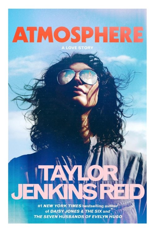 Book cover of Atmosphere by Taylor Jenkins Reid. Image shows a woman in sunglasses looking up at the sky.
