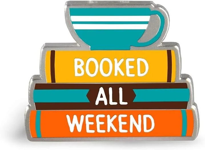 Pin of a stack of books and a cup of coffee. Reads: Booked all weekend