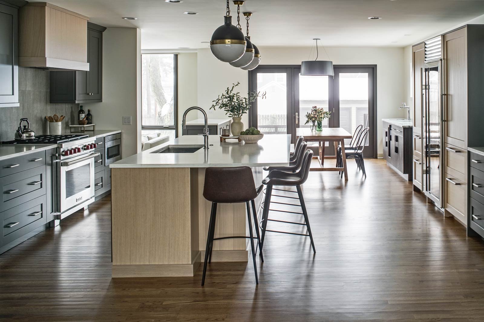 drury-design-chicago-neutral-modern-kitchen-island_pendant-lights-refriferator-columns.jpg