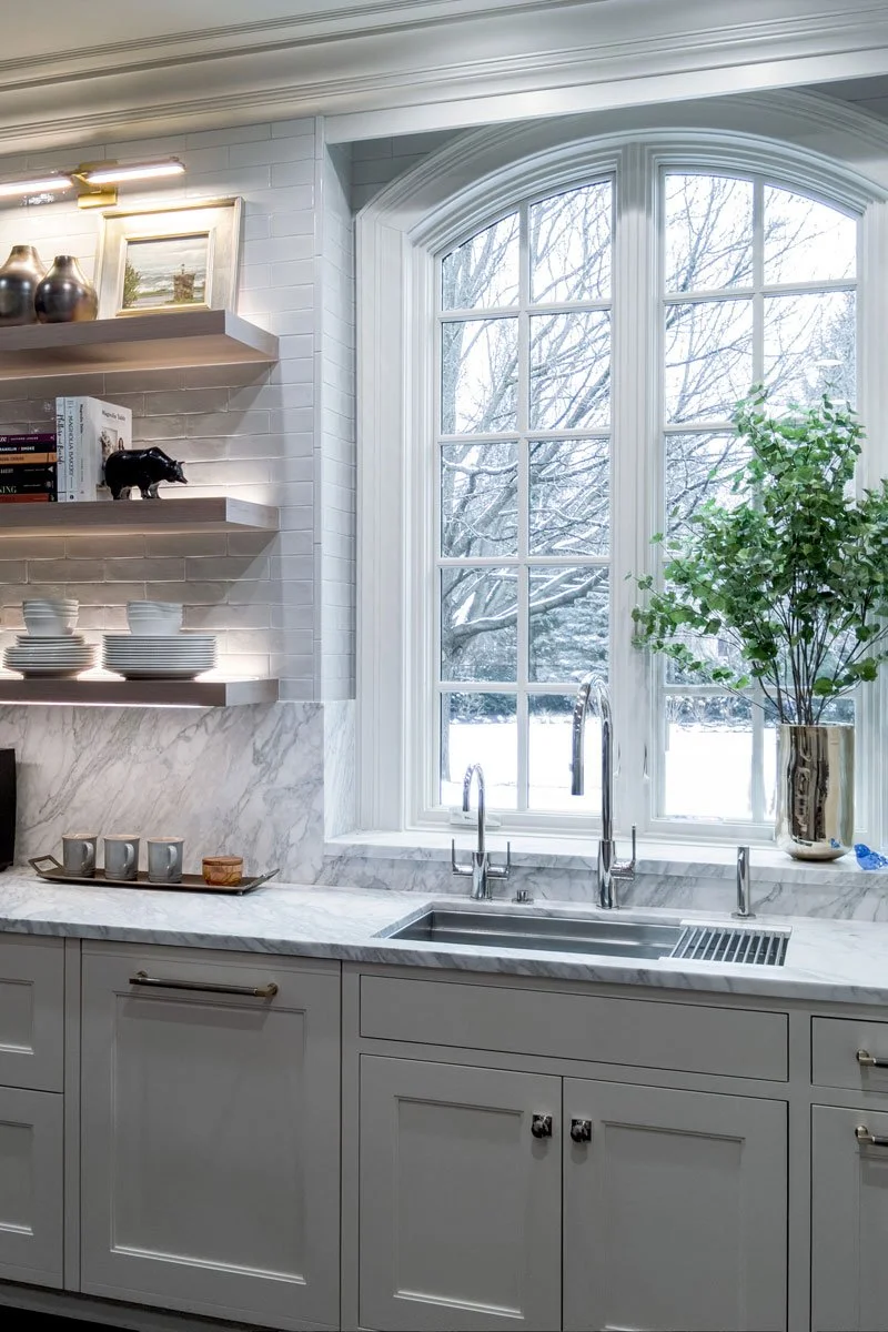 Timeless-Elegant-Kitchen_galley-sink-marble-backsplash-window.jpg