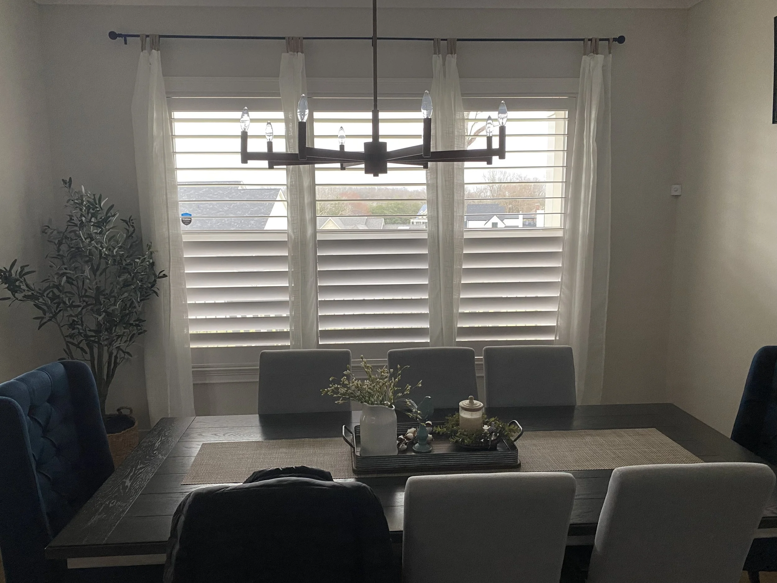 Hidden tilt, split tilt, 3 panel Plantation Shutter pared with curtains