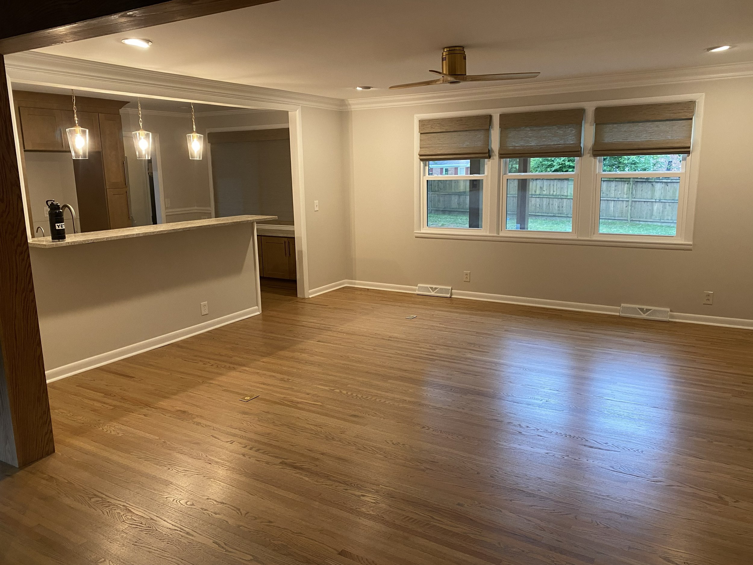 living room with big woven wood in back.jpg