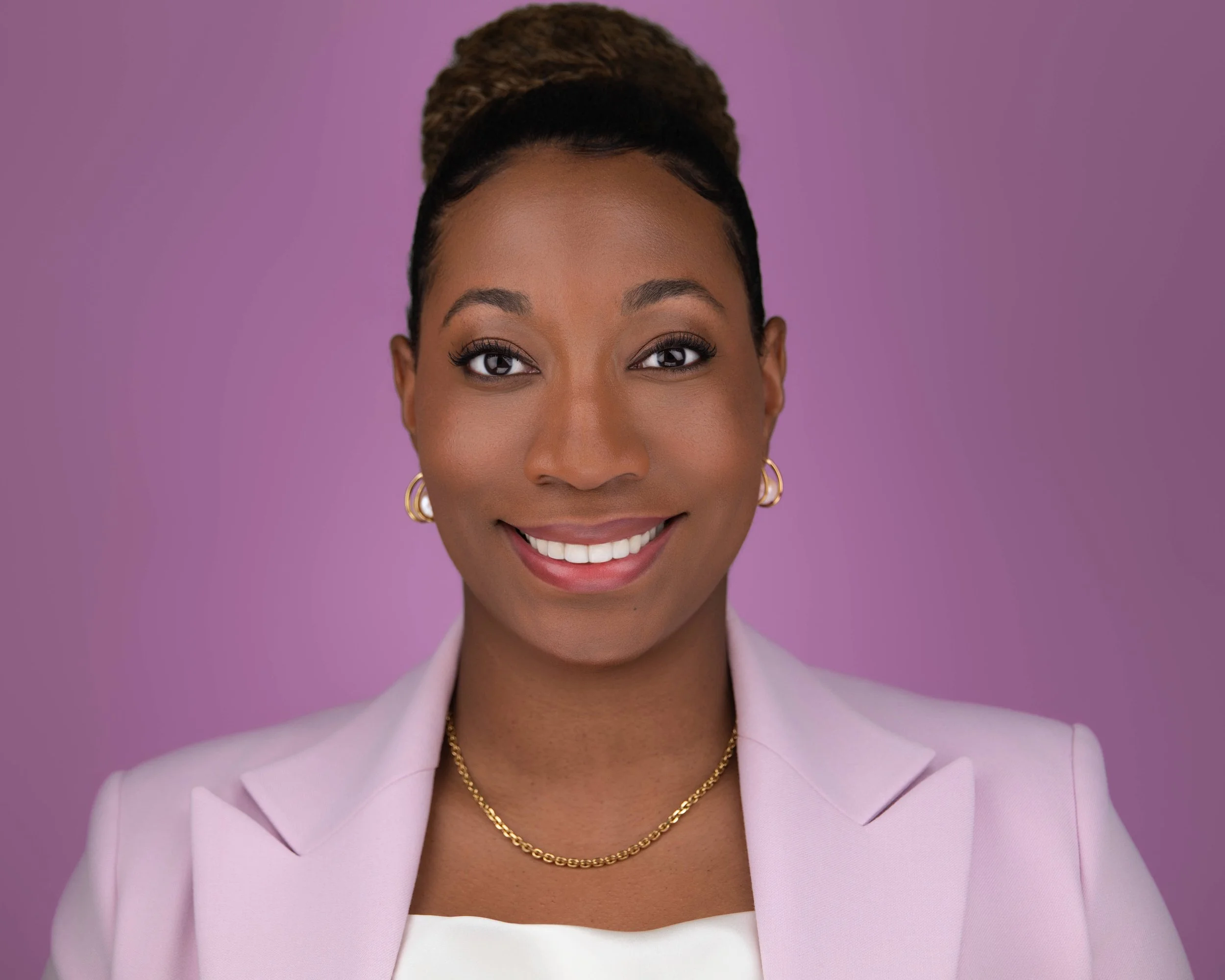 Professional LinkedIn headshot of attorney Mariah Hines in a pink blazer on a pink background, photographed by Steven B Studios in Lafayette, CA.