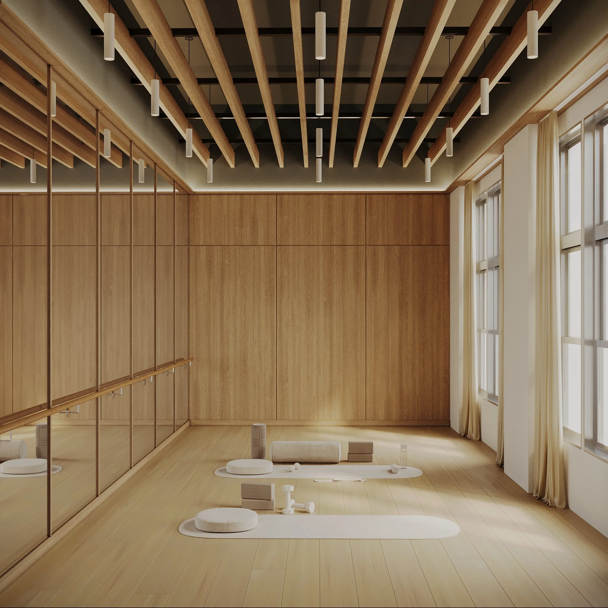 A stunning yoga studio available to residents.  The walls are lined with large windows, and the floor is made of light-colored wood. There are meditation cushions, blocks, and mats arranged neatly on the floor, suggesting a yoga or meditation space.